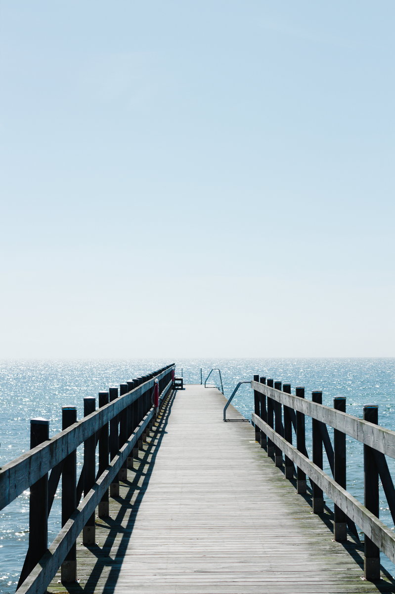 Wooden pier in the sea portrait